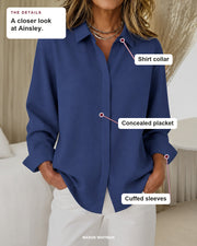 Ainsley blouse details: shirt collar, concealed placket, cuffed sleeves.