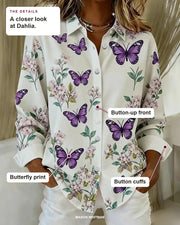 Dahlia blouse details: butterfly print, button-up front, button cuffs.