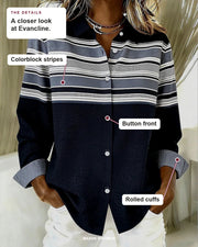 Evancline blouse details: colorblock stripes, button front, rolled cuffs.