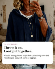 Jeanne sweater editorial card: drawstring hood, wide ribbed sleeves, ribbed hem.