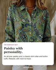 Katarina blouse editorial card: paisley print, button-up front, button cuffs.