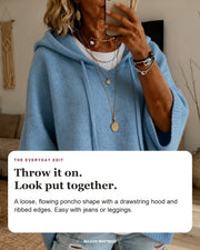 Lea sweater editorial card: drawstring hood, wide ribbed sleeves, ribbed hem.