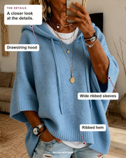 Lea sweater details: drawstring hood, wide ribbed sleeves, ribbed hem.