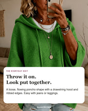 Margaux sweater editorial card: drawstring hood, wide ribbed sleeves, ribbed hem.