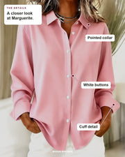 Marguerite blouse details: pointed collar, white buttons, cuff detail.