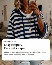 Marine sweater editorial card: drawstring hood, wide ribbed sleeves, ribbed hem.
