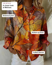 Melrose blouse details: botanical print, button-up front, cuffed sleeves.