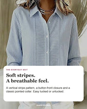 Norelle blouse editorial card: pointed collar, button front, vertical stripes.