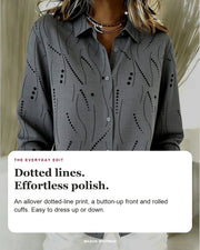 Pernella blouse editorial card: dotted-line print, button-up front, rolled cuffs.