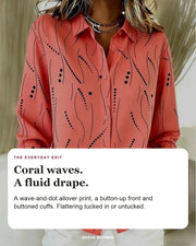 Priscilla blouse editorial card: wave-and-dot print, button-up front, buttoned cuffs.