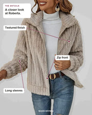 Roberta details: Textured finish, Zip front, Long sleeves.