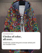 Rowena cardigan editorial card: A lined hood, a plush lining and a circular rainbow print from shoulder to hem.
