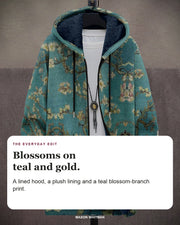 Vincent cardigan editorial card: A lined hood, a plush lining and a teal blossom-branch print.