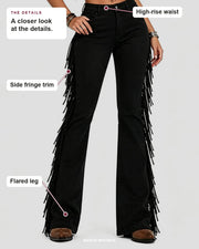Black flare jeans showing the high-rise waist, side fringe trim and flared leg.
