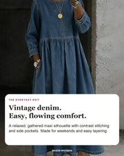 Zephyrelle denim maxi dress in blue with editorial text about its gathered silhouette, contrast stitching and side pockets.